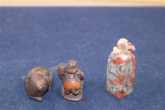 Two Japanese carved wood netsuke and a Chinese soapstone seal